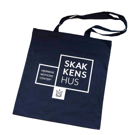 Mulepose i en mörkblå färg med Skakkens hus – hjärnans motionscenter och Dansk Skoleskaks logotyp tryckt på.